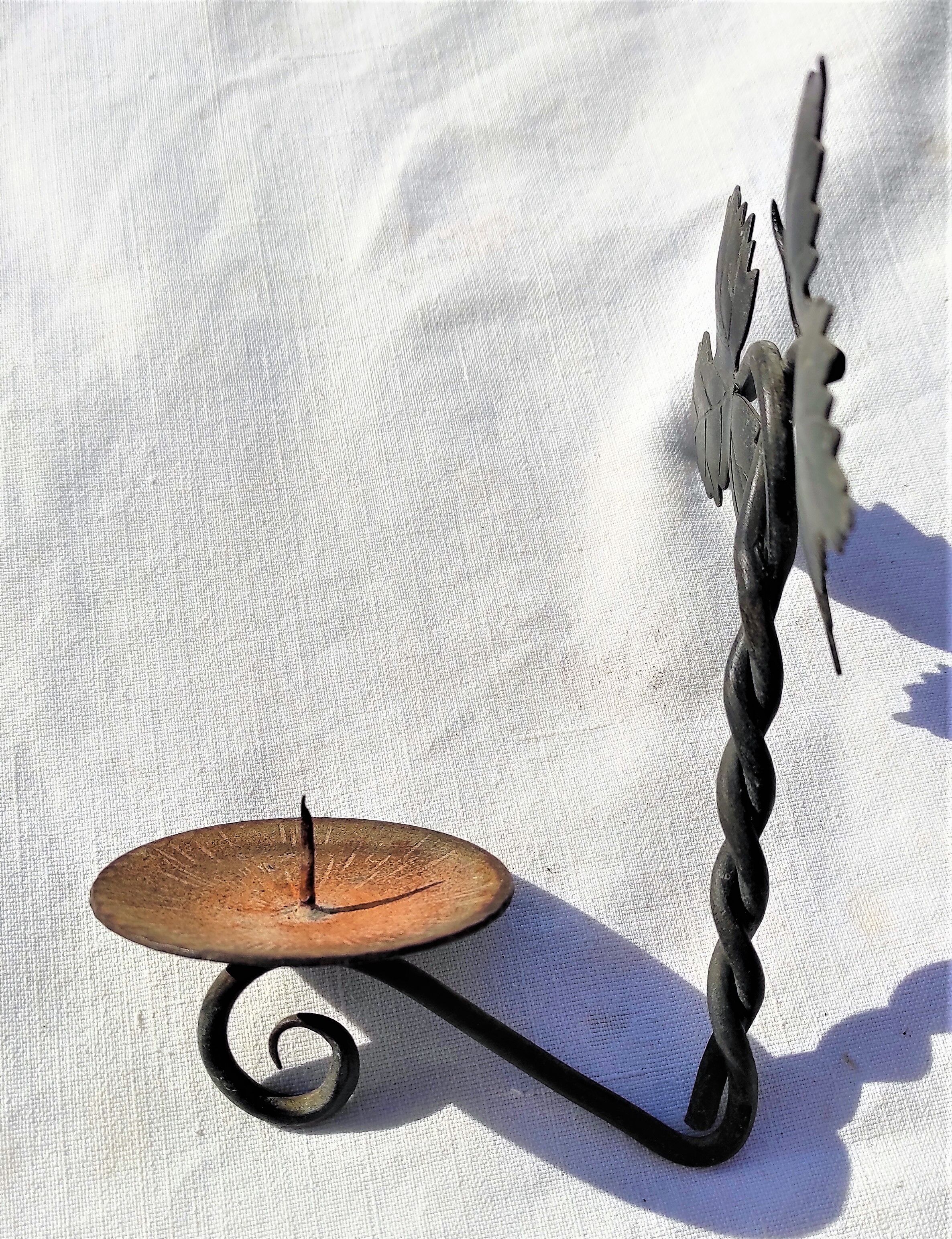 Wrought iron wall candle lamp with ancient vine leaves
