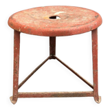Red tripod industrial metal stool