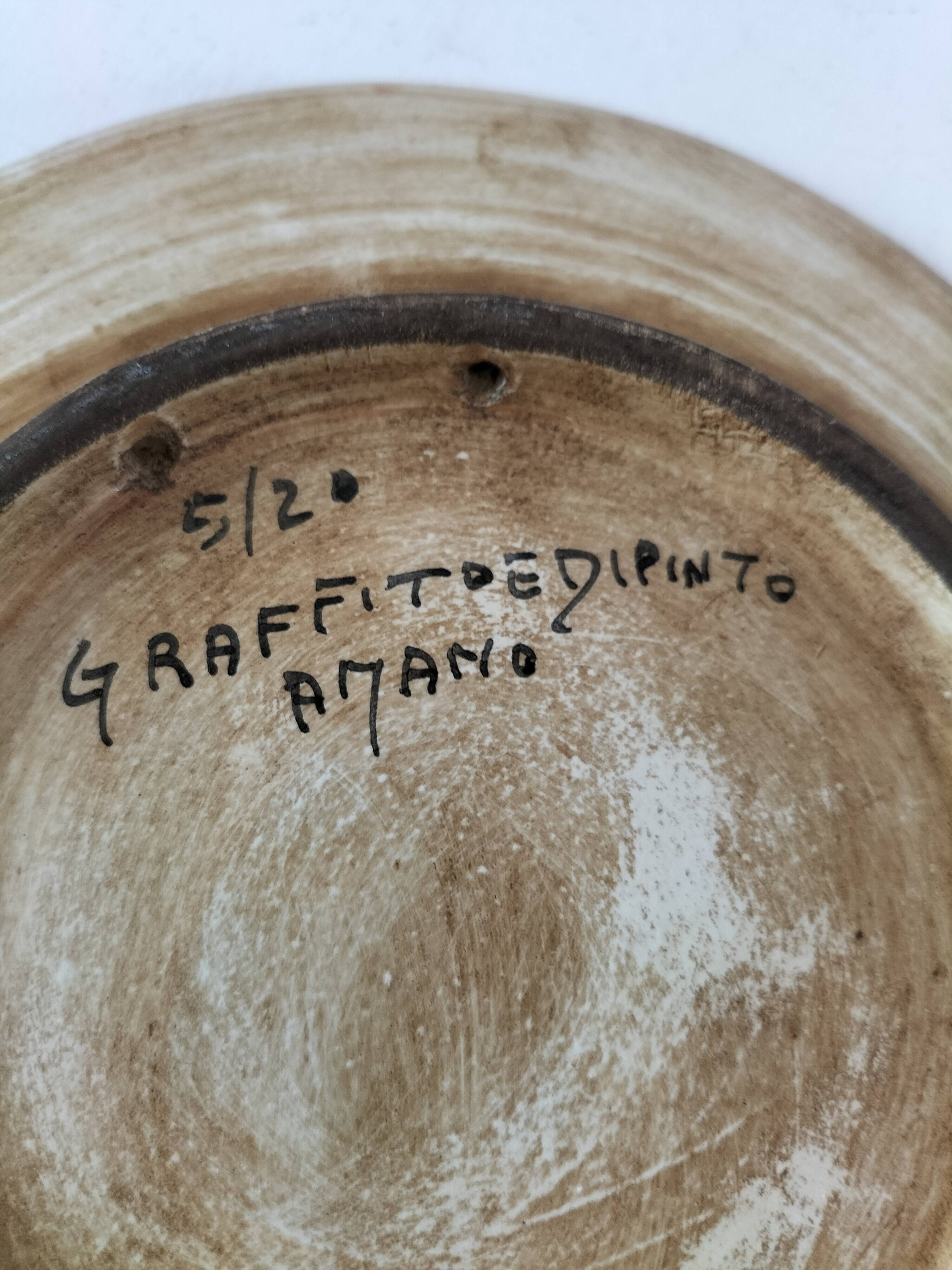 Spanish earthenware plate, hand-painted floral decoration.