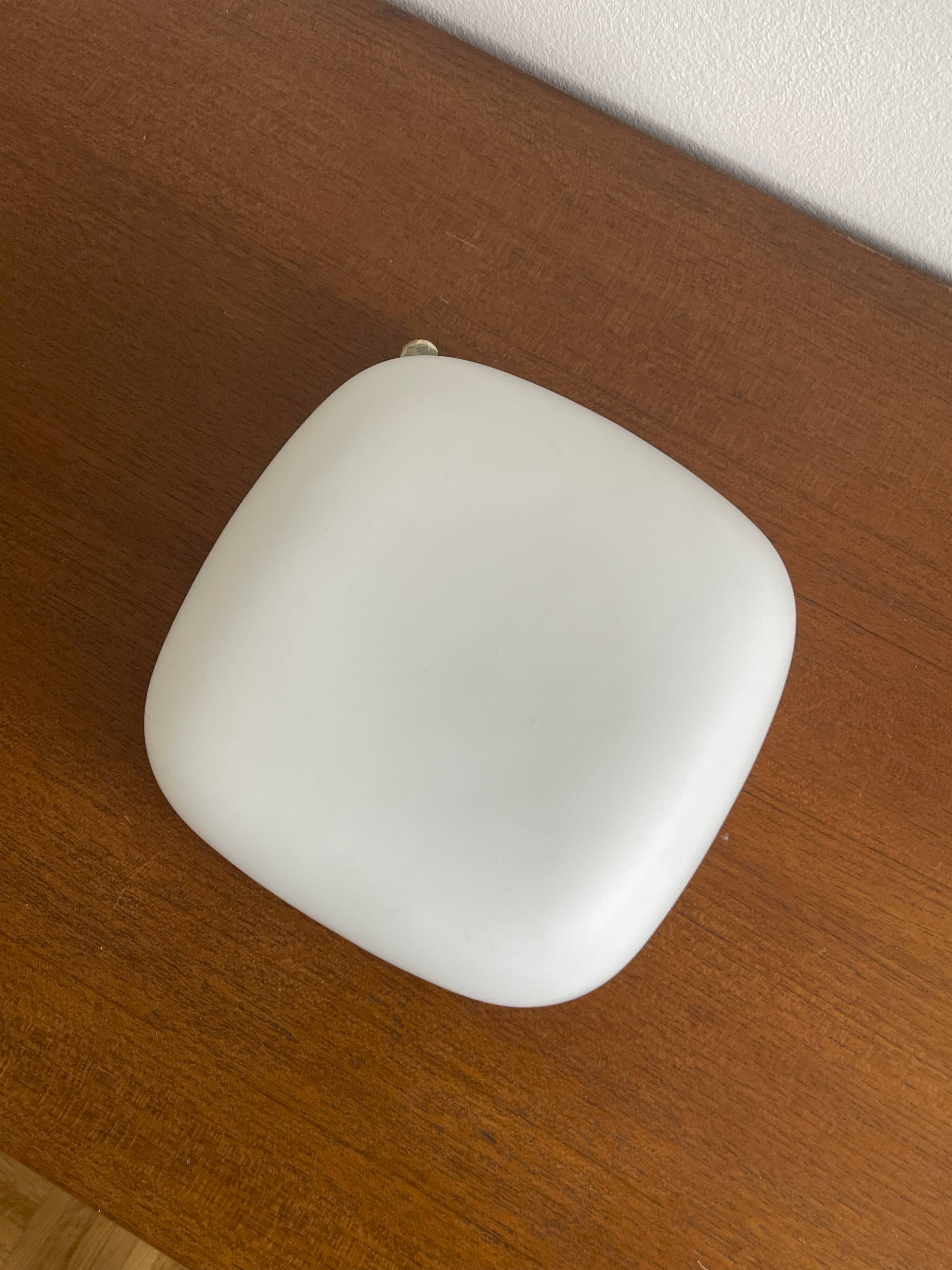 Square wall lights in sandblasted white glass