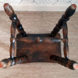 Brown turned wooden stool.