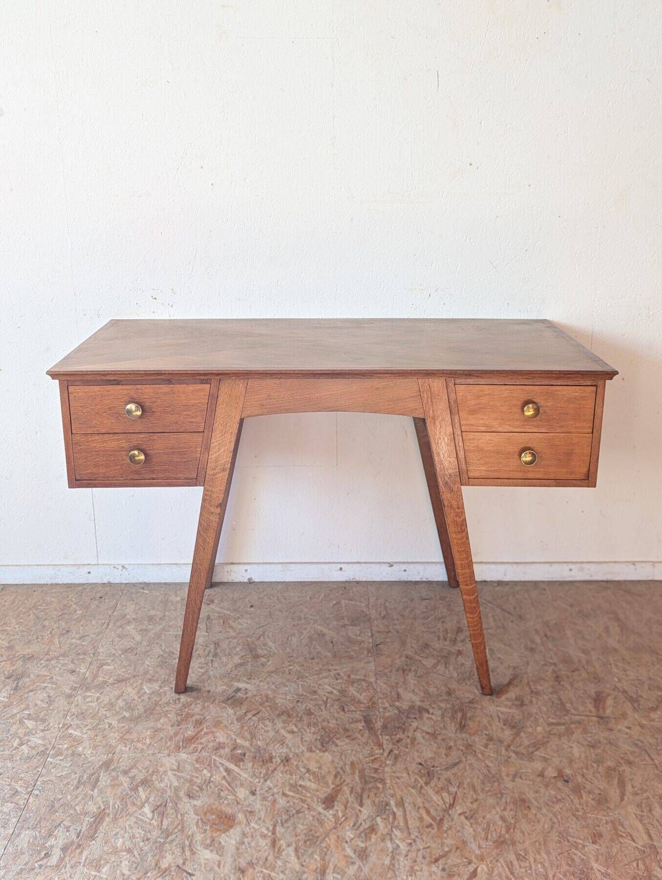 1950s oak double-sided desk with compass legs.