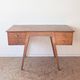 1950s oak double-sided desk with compass legs.