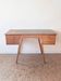 1950s oak double-sided desk with compass legs.
