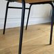 Vintage chair with green imitation leather armrests