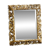 Mirror, late 19th century, carved wood, gilded stucco.
