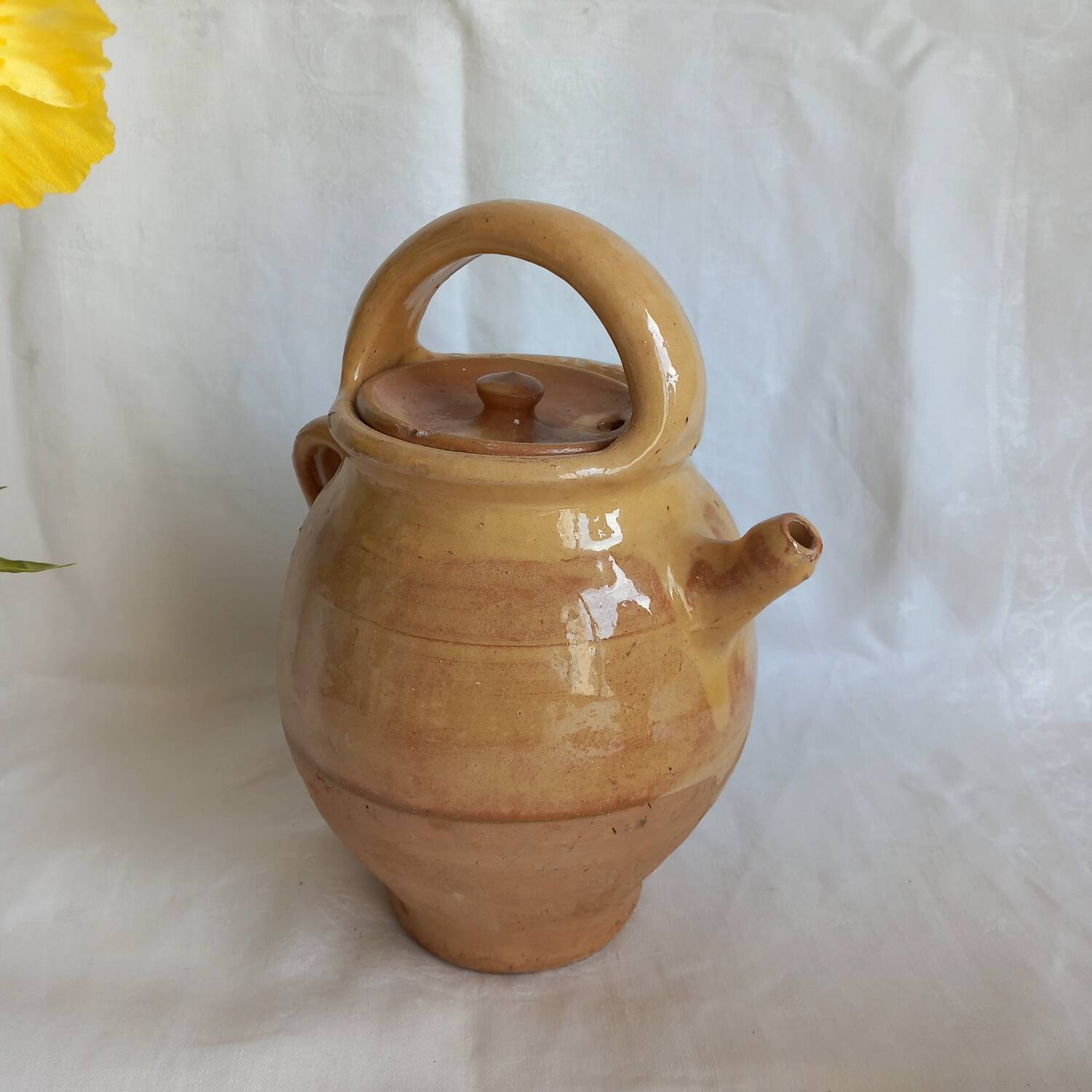 Jug, small terracotta pitcher with yellow glaze