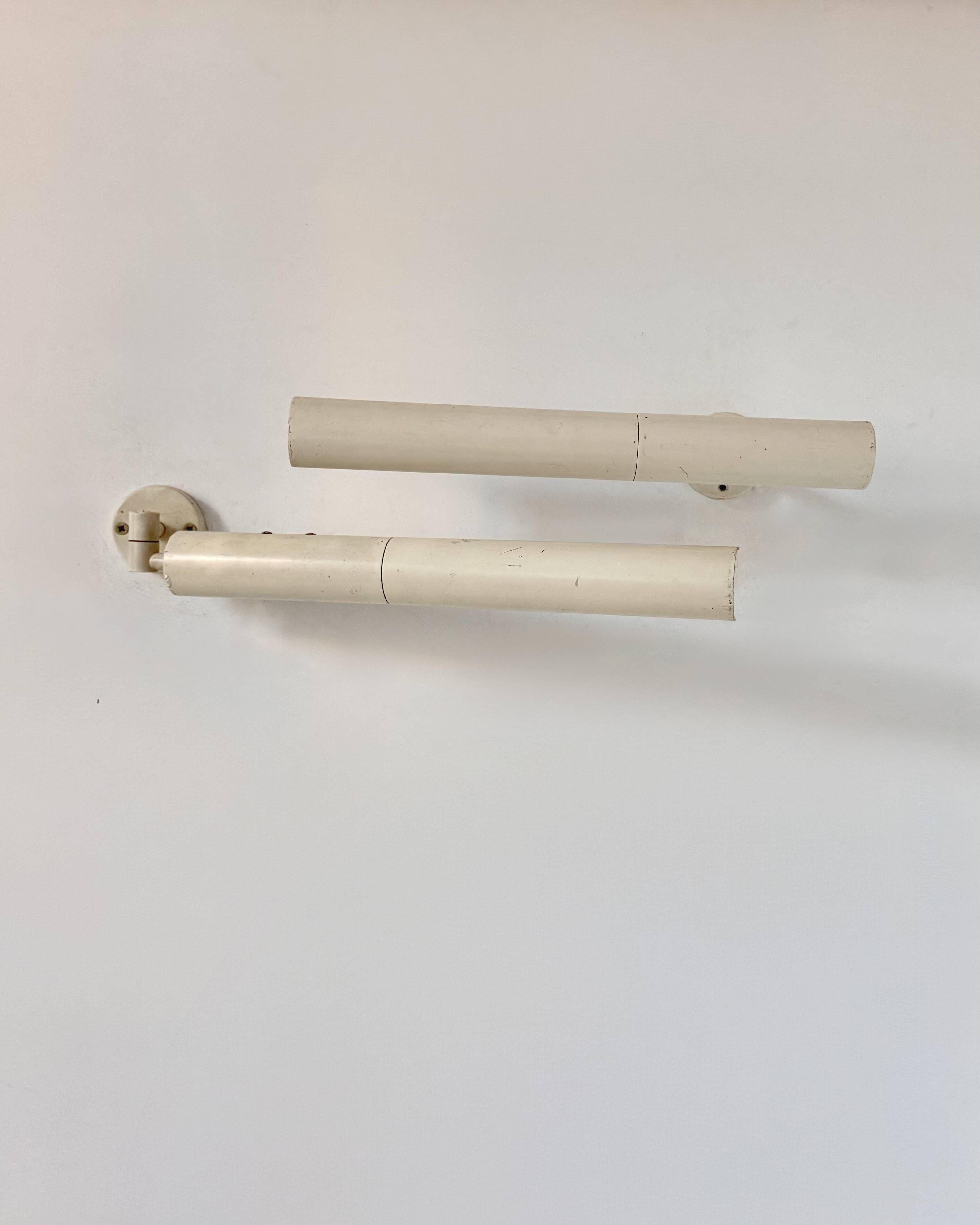 Pair of vintage matte white metal wall lights, France 1970.