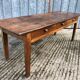 Antique chestnut farmhouse table with 3 drawers on the front.