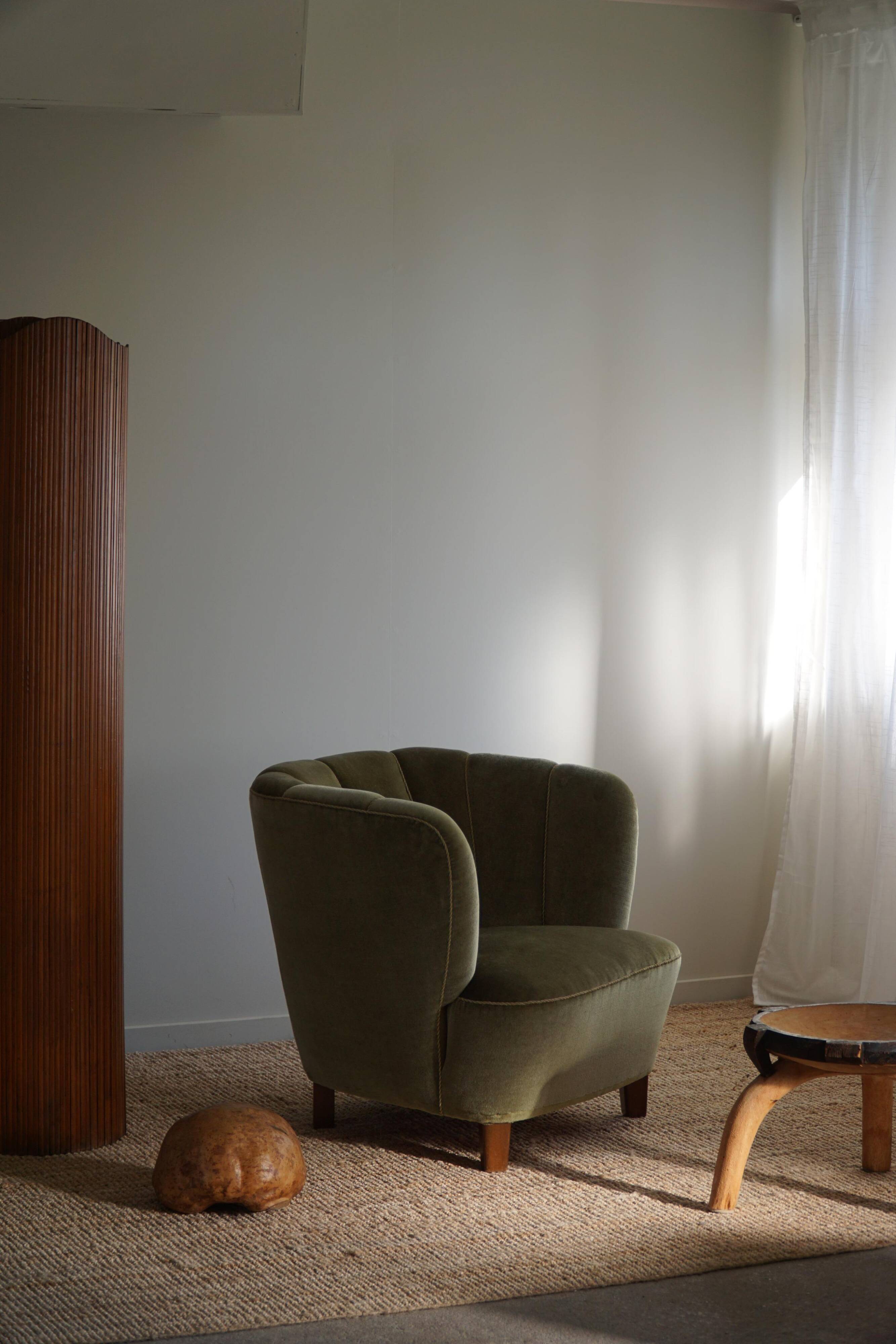 Curved Danish club chair from the mid-century, in the style of Viggo Boesen, 1940s.