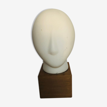 Ceramic head on wooden base