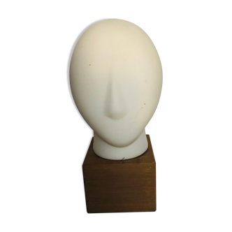 Ceramic head on wooden base