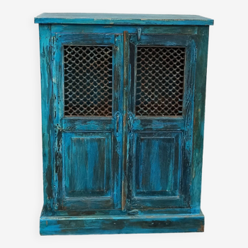 Old wooden cabinet with doors with grille
