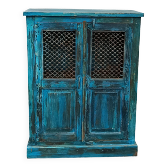 Old wooden cabinet with doors with grille