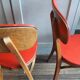 Lot of 2 wooden chairs and red skai