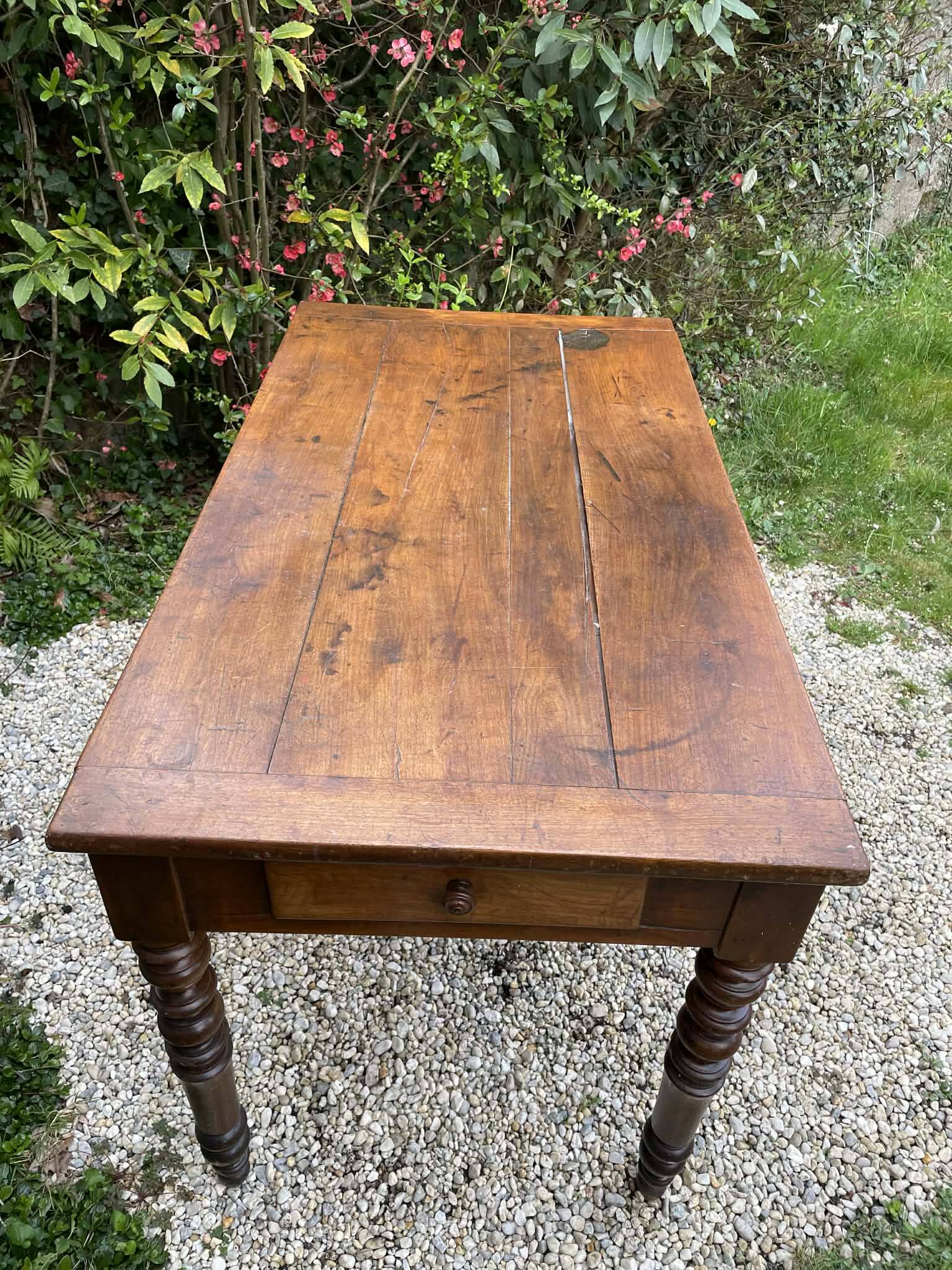 Old kitchen table with chopping board.