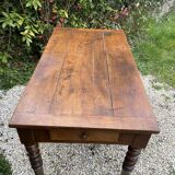 Old kitchen table with chopping board.