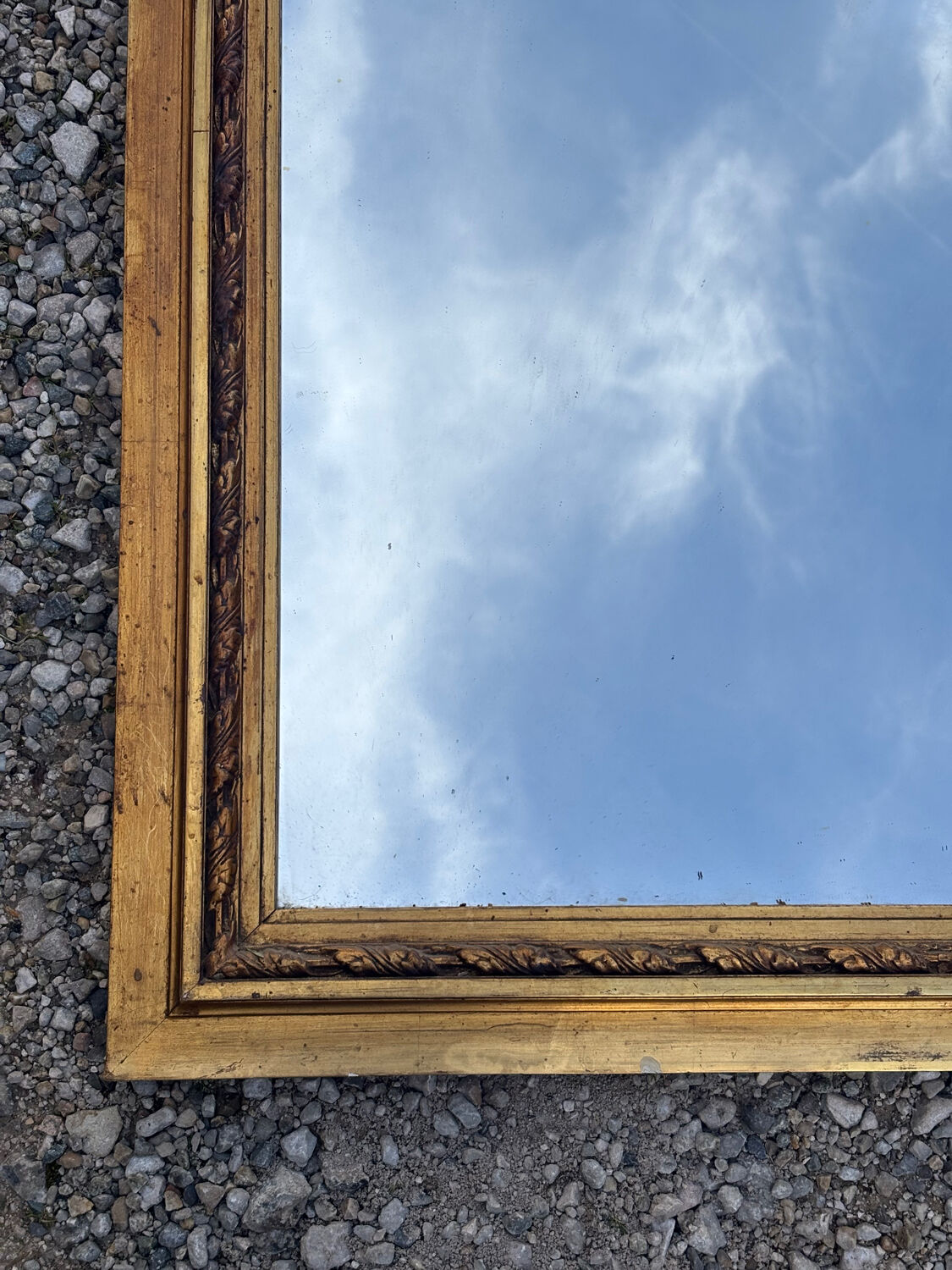 Golden trumeau mirror in Louis XVI style, 20th century.