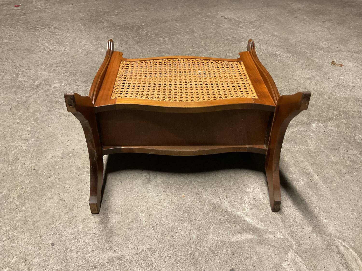 Vintage wicker newspaper rack