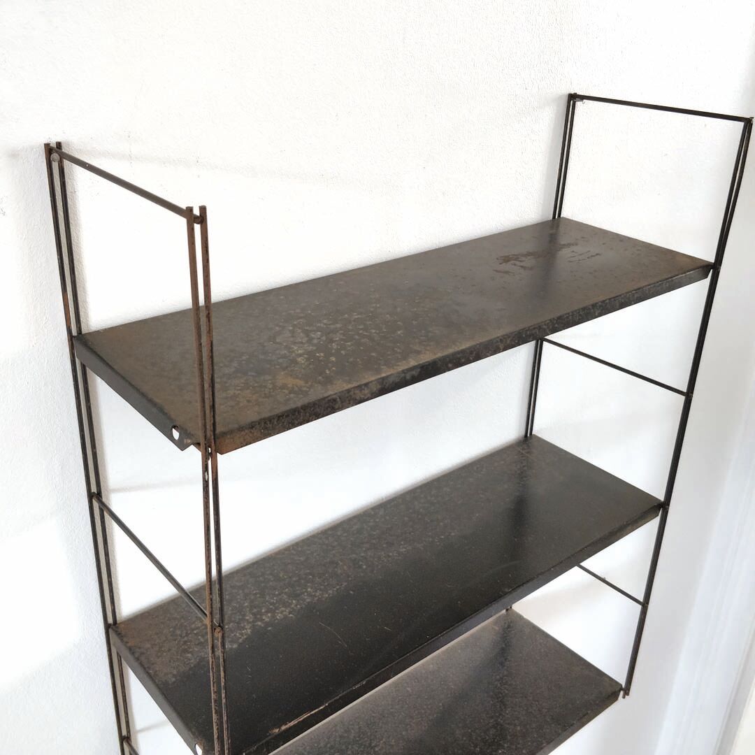 Patinated metal wall shelf