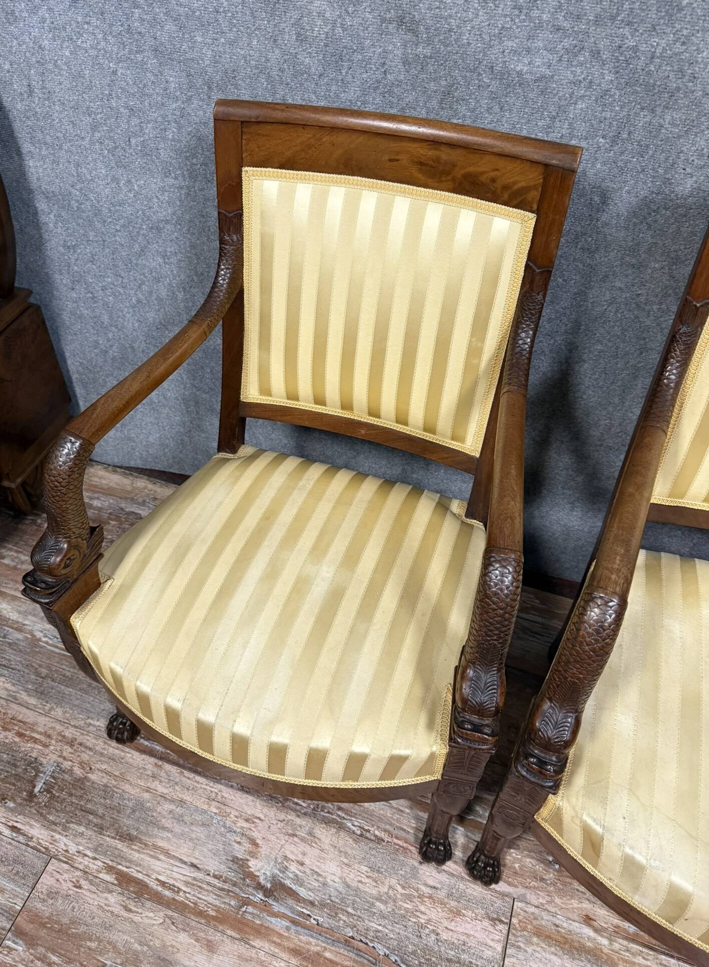 Pair of Empire period mahogany dolphin armchairs