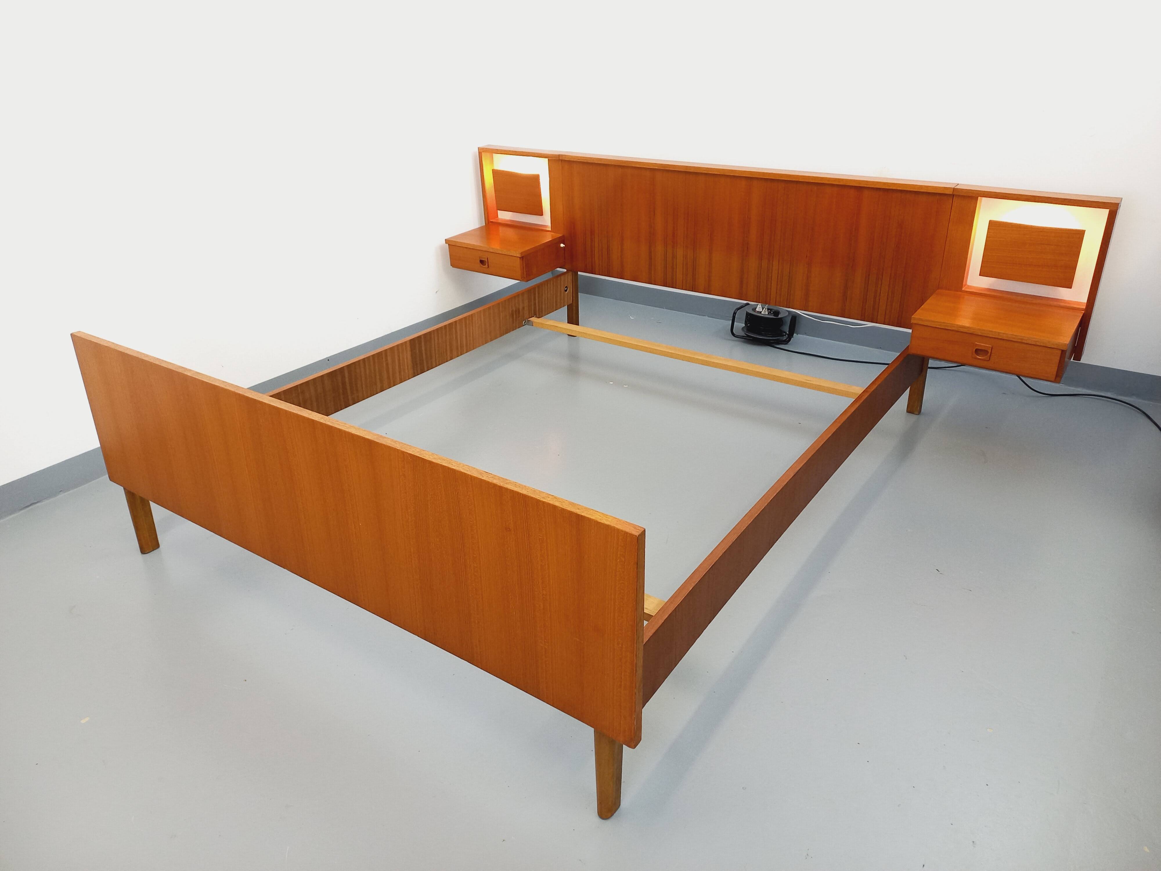 Vintage Scandinavian style double bed in teak from the 60s with integrated bedside lights