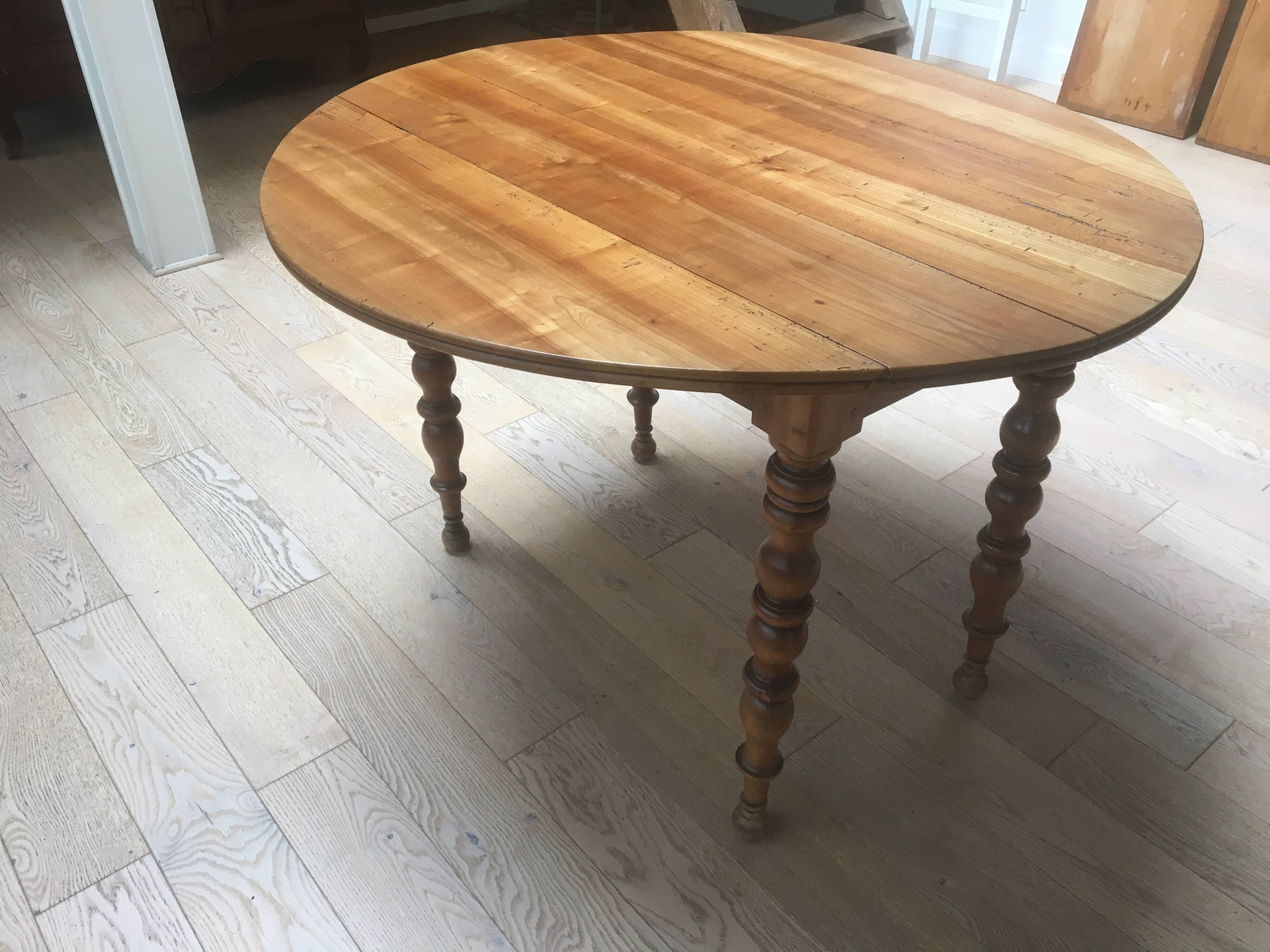 oval walnut dining table with 2 extensions