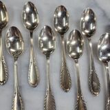 Set of 12 spoons of the middle twentieth in silver metal