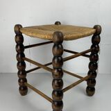 Brutalist wood turned bobbin rush stool in the style of Charles Dudouyt