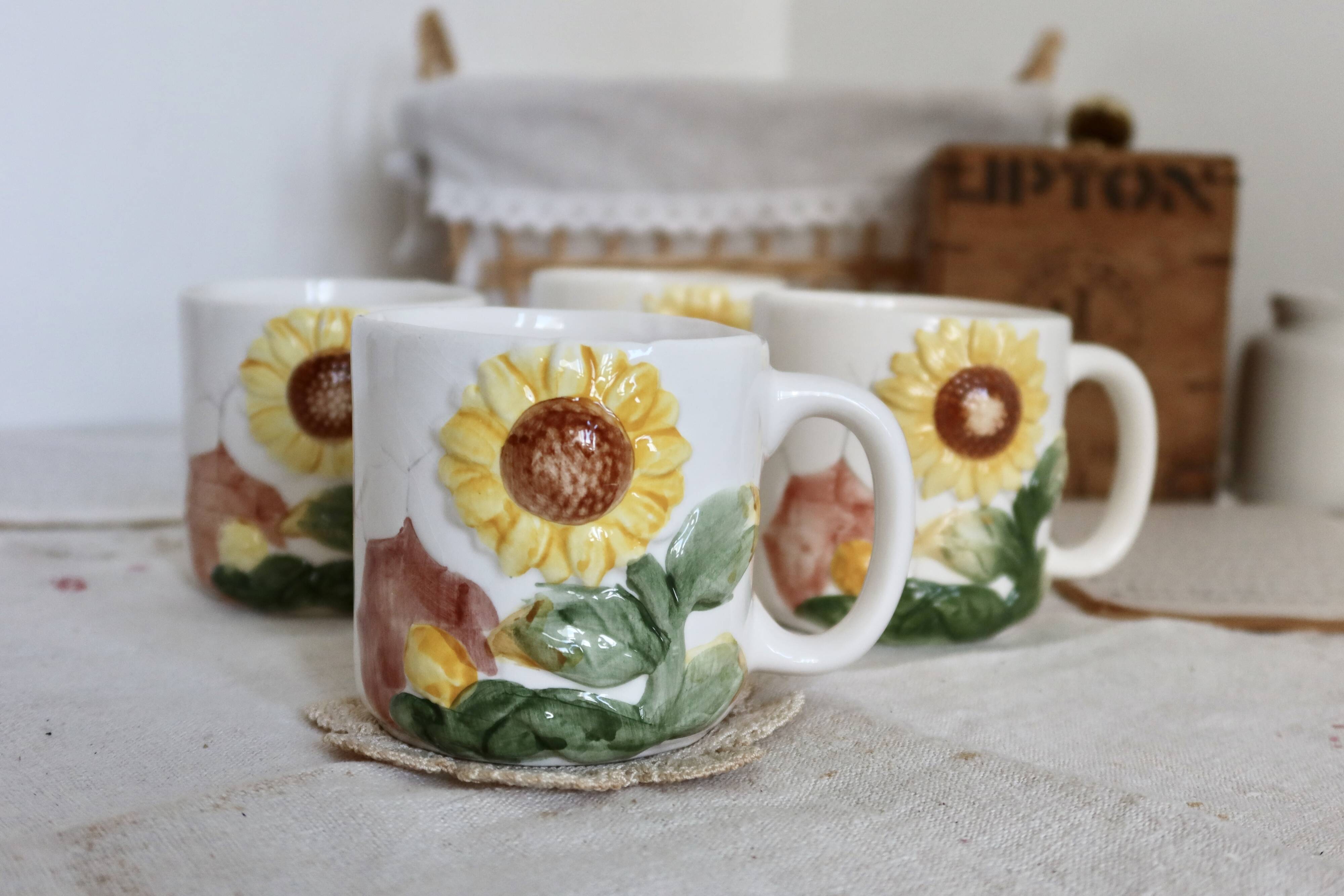 Set of 4 vintage barbotine cups / mugs with polychrome sunflower pattern