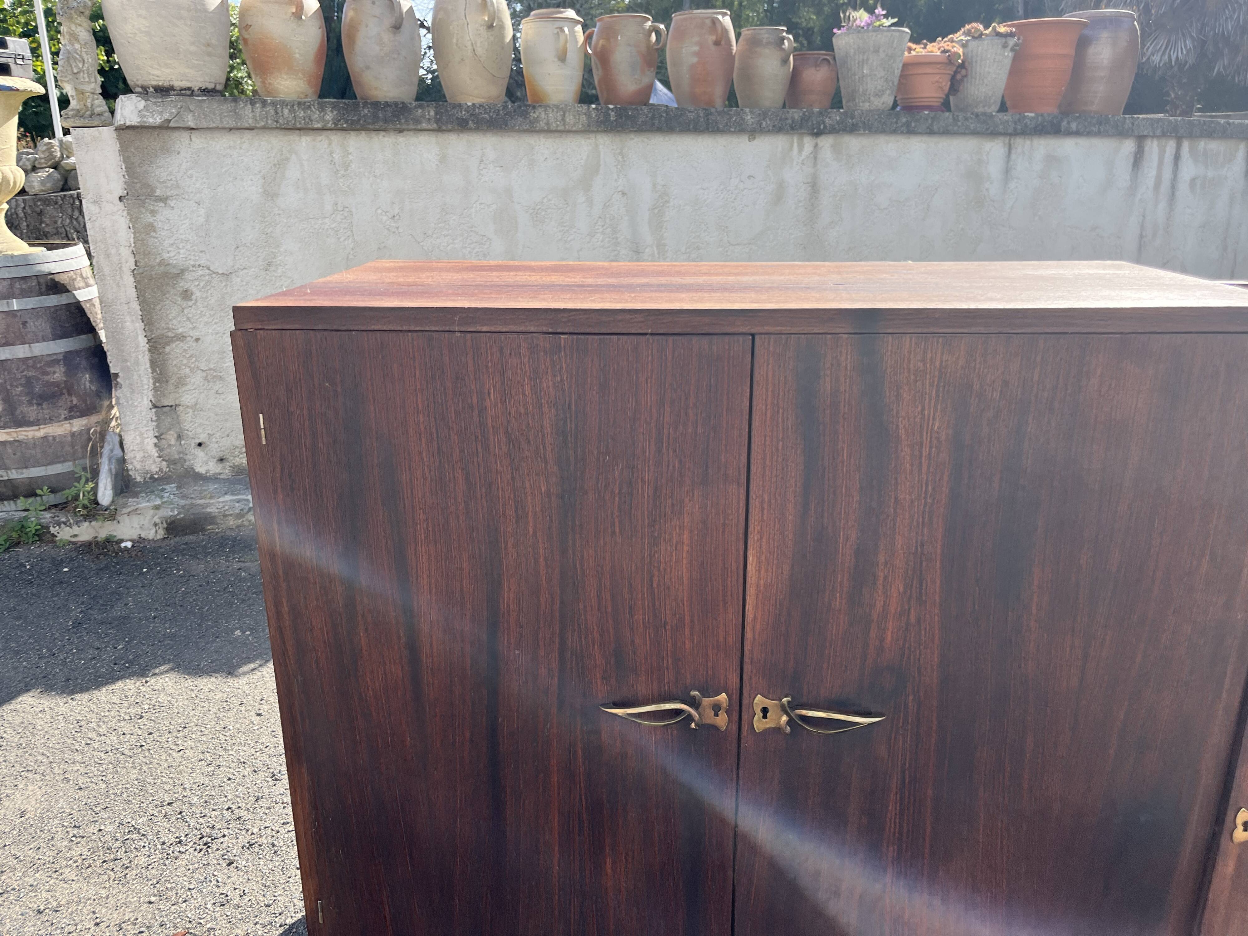 Asymmetrical antique Art Deco sideboard in rosewood veneer.
