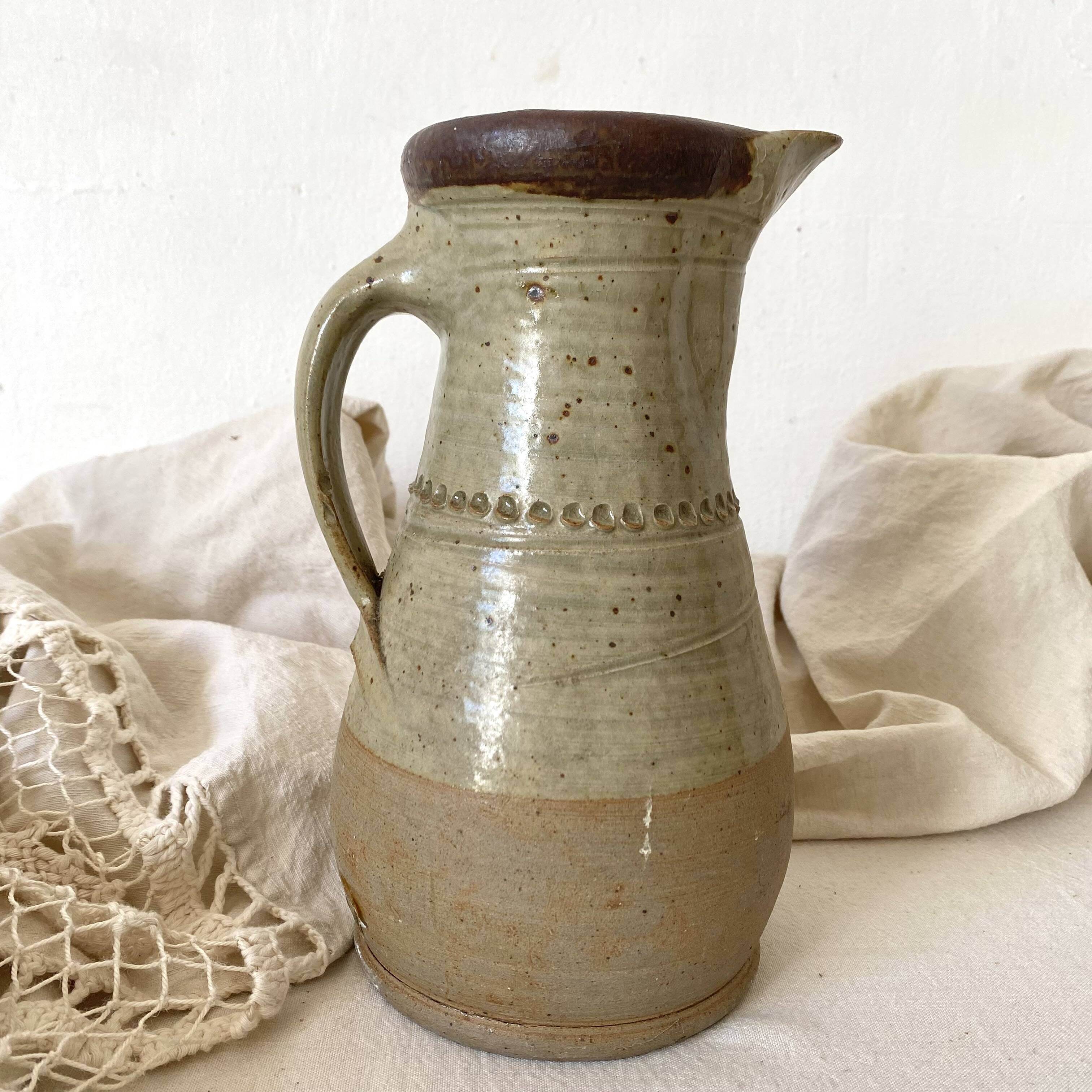 Vintage handcrafted terracotta pitcher