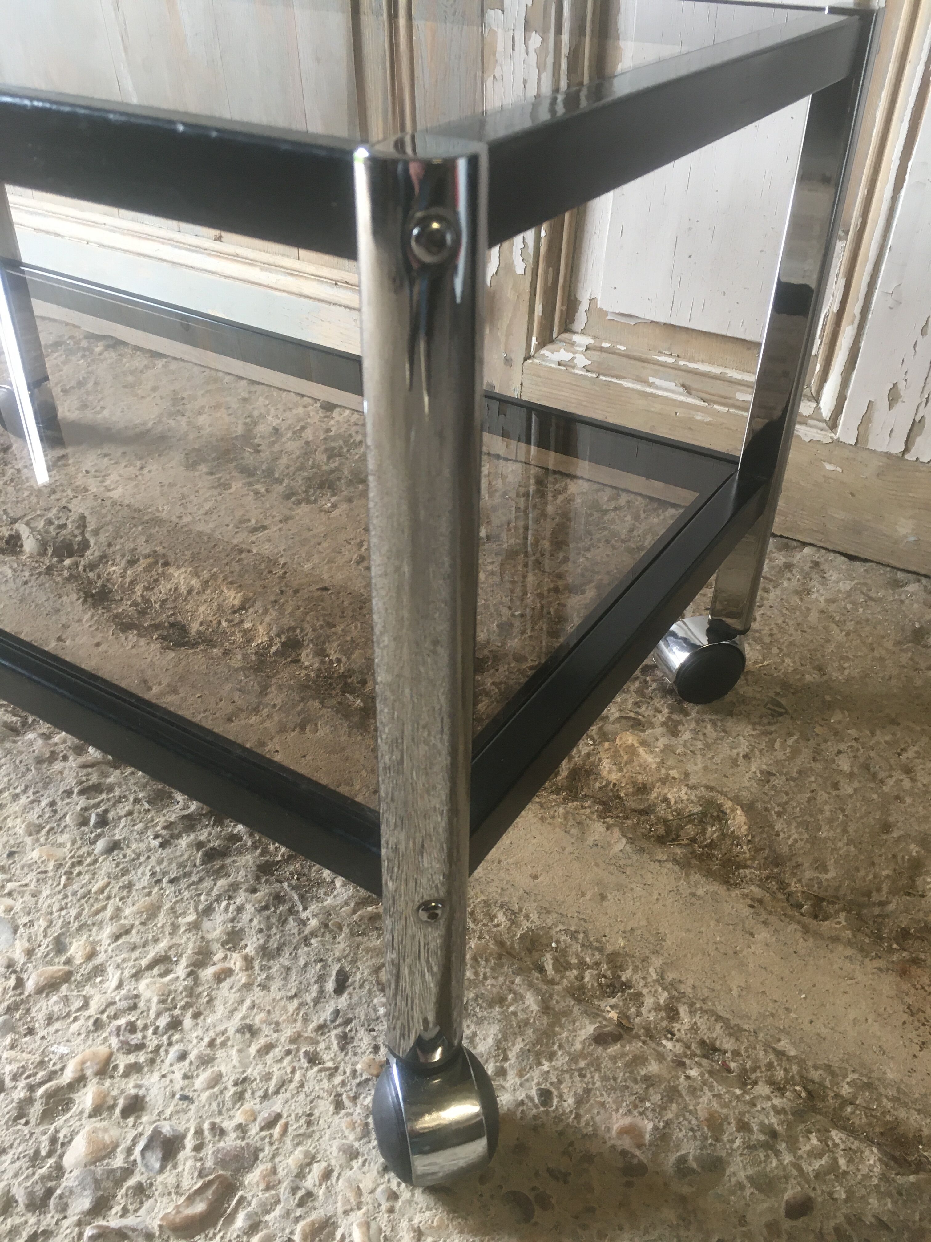 Metal coffee table with smoked glass.