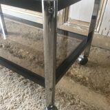 Table basse en métal et verres fumés