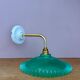 Green vintage plastic wall lamp with a curved arm