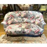 Napoleon III sofa upholstered in a floral patterned fabric