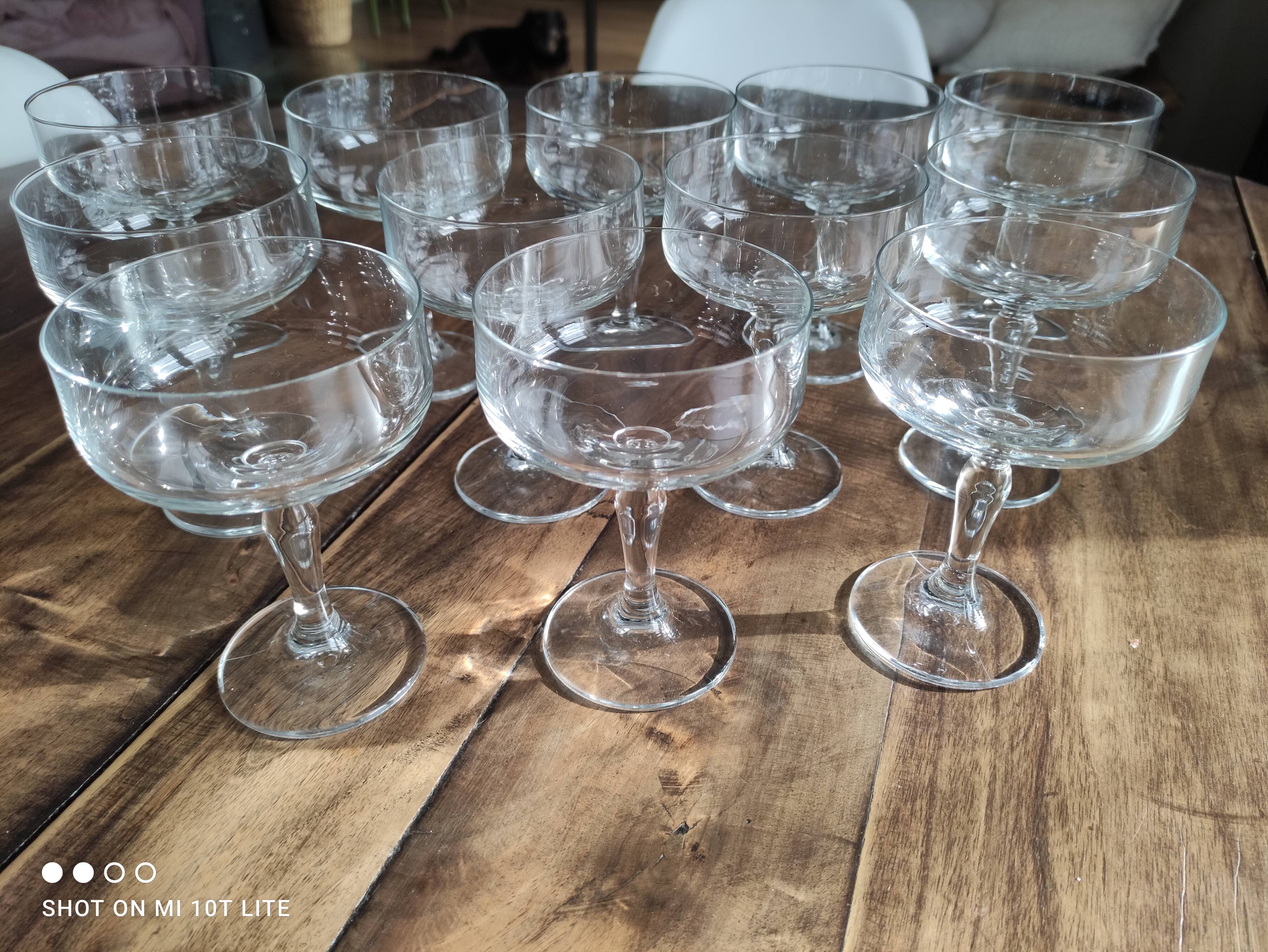 Set of 12 vintage glass champagne glasses with curved foot
