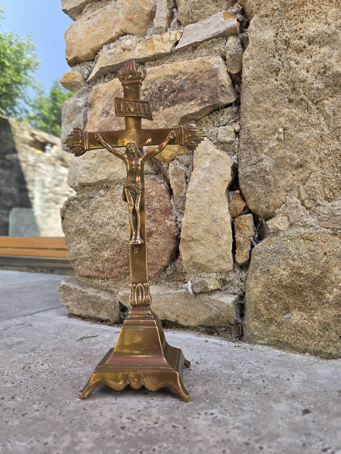 19th-century brass crucifix on a base