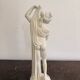 Sculpture of a bathing nymph in neoclassical style, made of plaster.