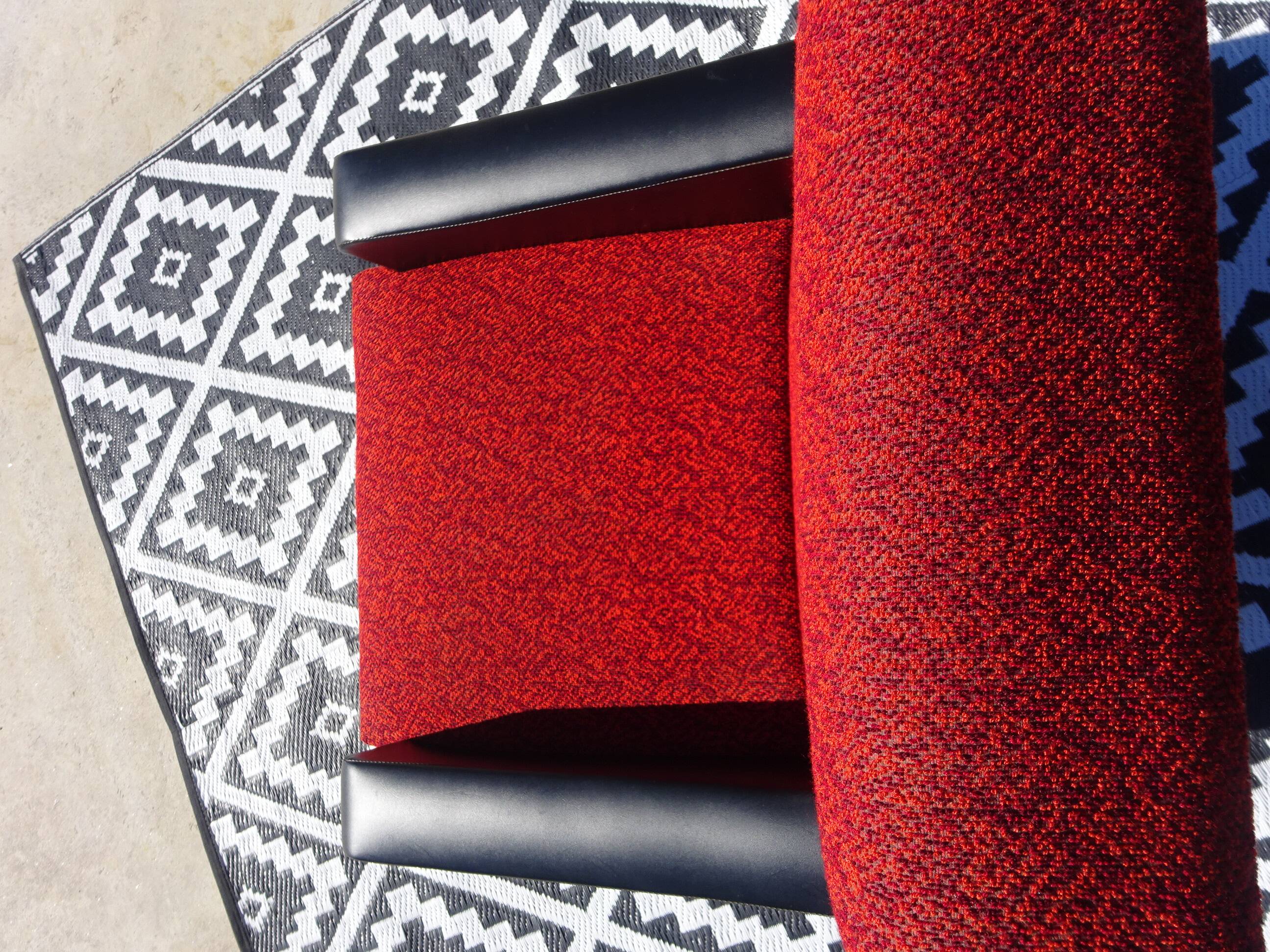 Vintage armchairs in red and black faux leather, the pair.