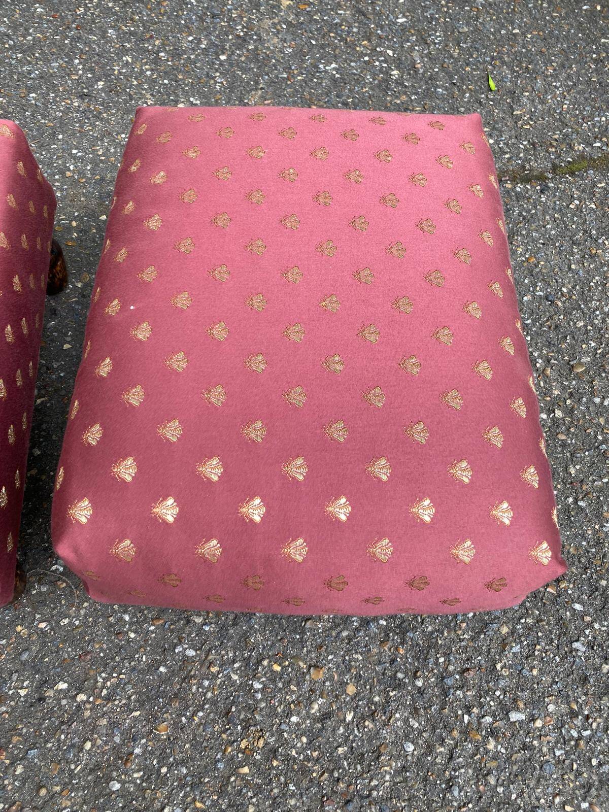 2 low footstools in burgundy fabric and solid wood