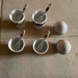 Set of 4 egg cups with their spoons, salt shaker, colored pepper shaker