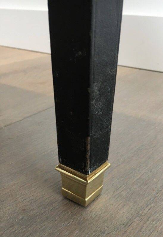 Rare small clock table in leather and brass. In the style of Jacques Adnet.