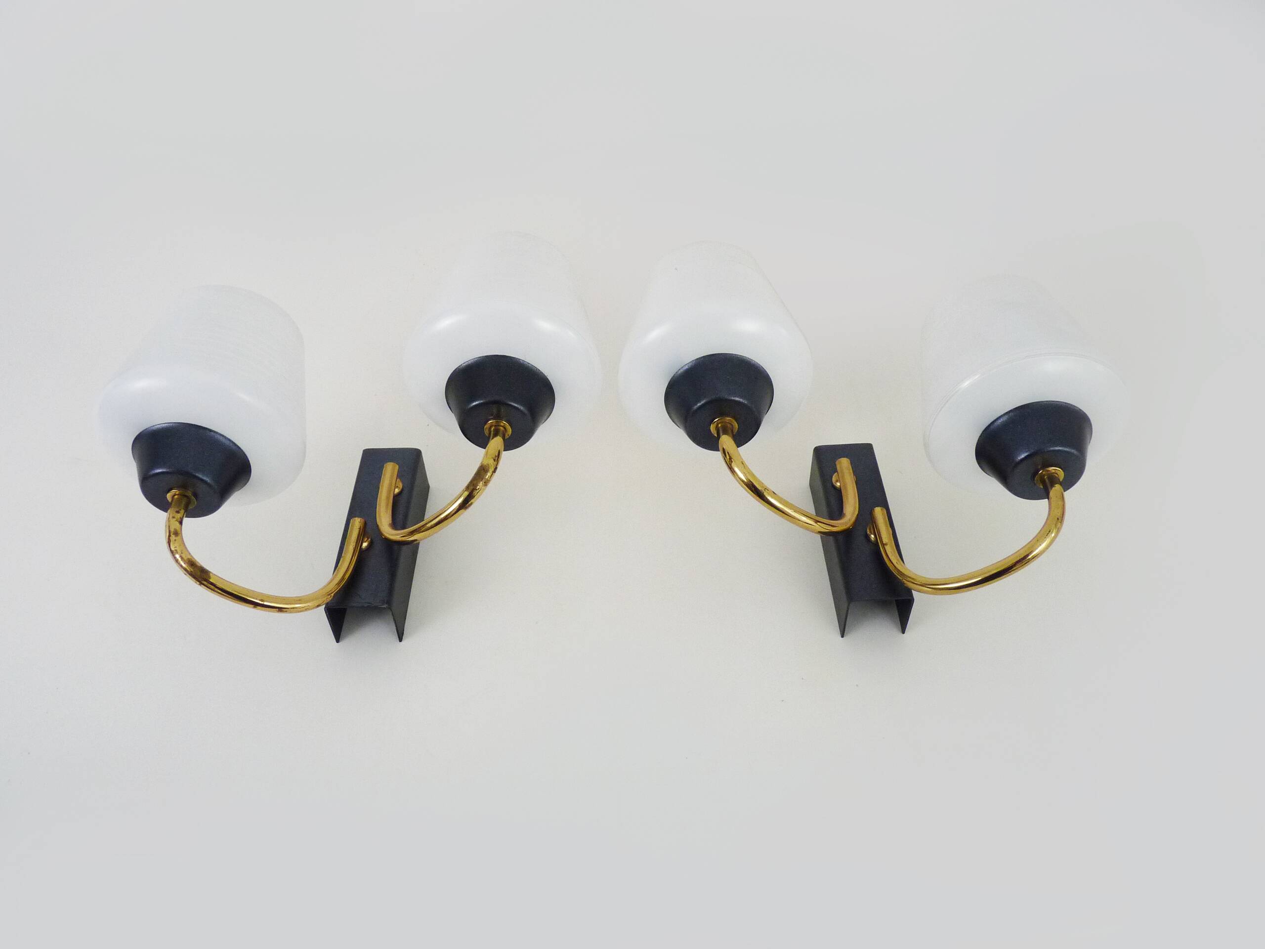 Pair of vintage Maison Arlus wall lights from the 1950s in brass, glass globe.