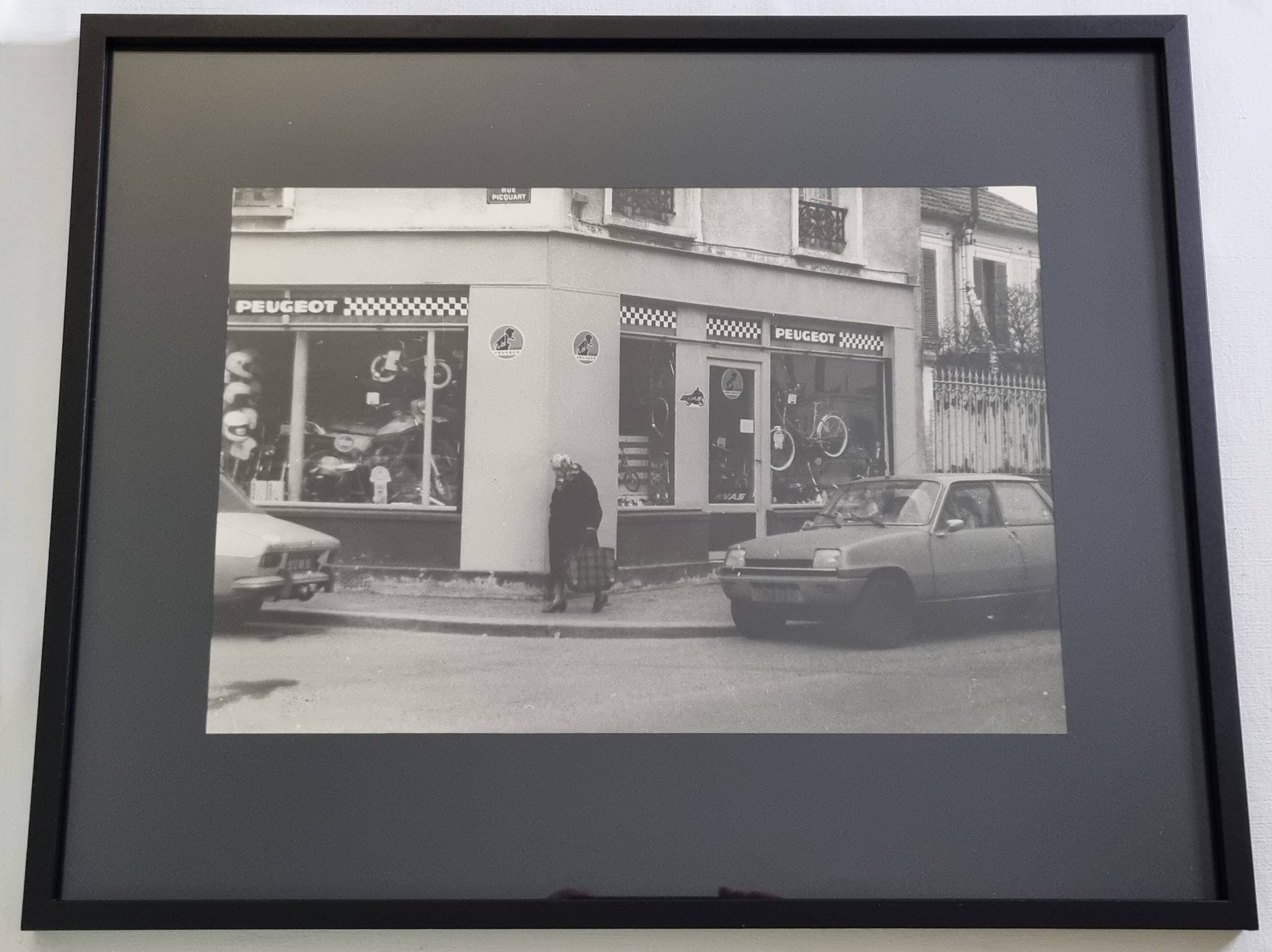 Vintage silver gelatin print of a street scene in a shop window, 1970s, framed, 52 x 42 cm