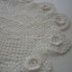 Oval white placemat in crocheted cotton