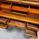 Cylinder desk with marquetry featuring a crosshatch design.