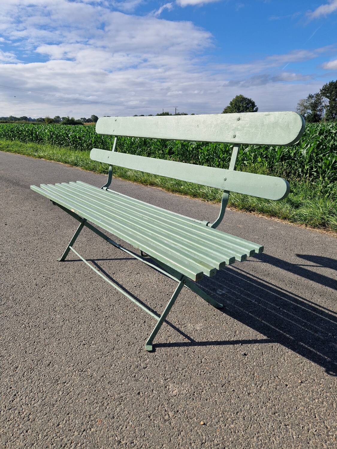 Ancien banc de jardin pliant en fer forgé vert