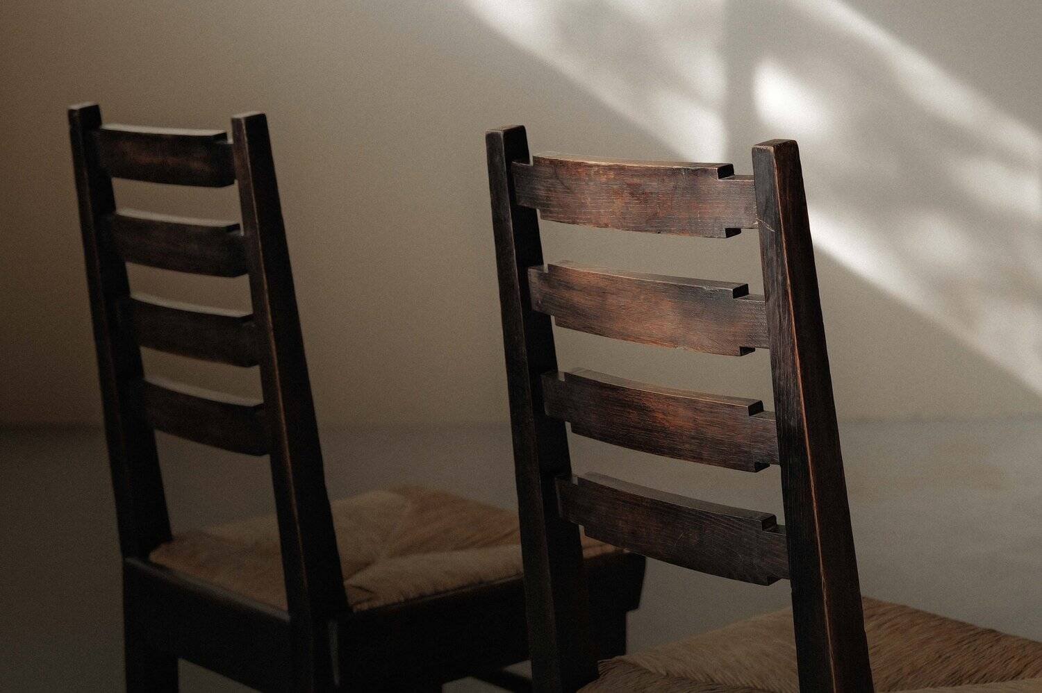 Modernist chairs in oak and woven straw, France, circa 1948