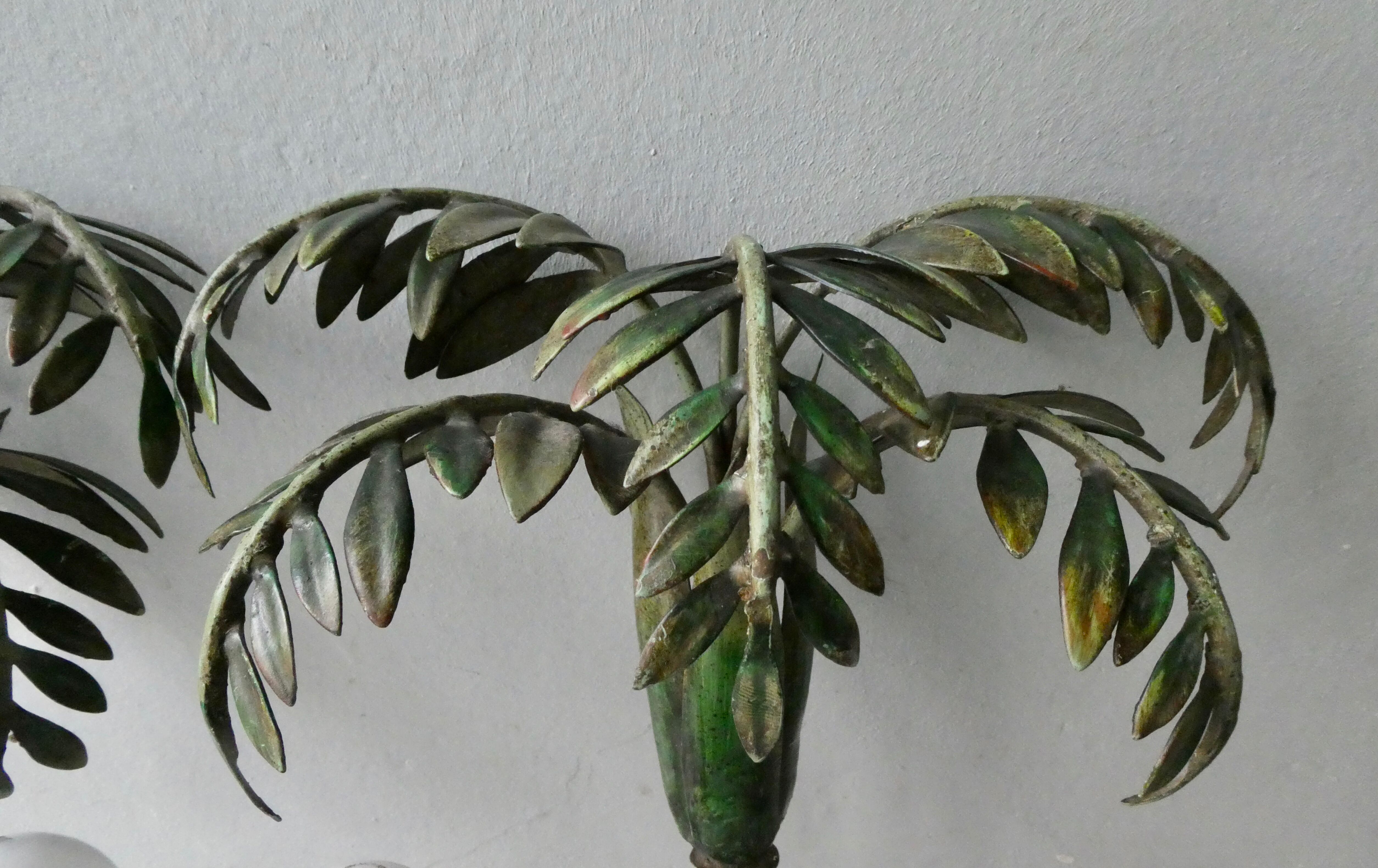 Pair of bamboo and palm sconces in metal